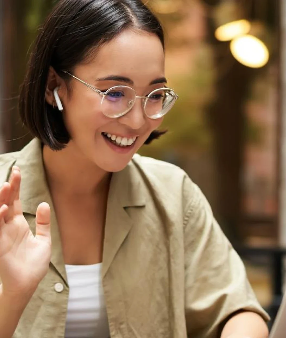 Trainer leading an online session with earbuds