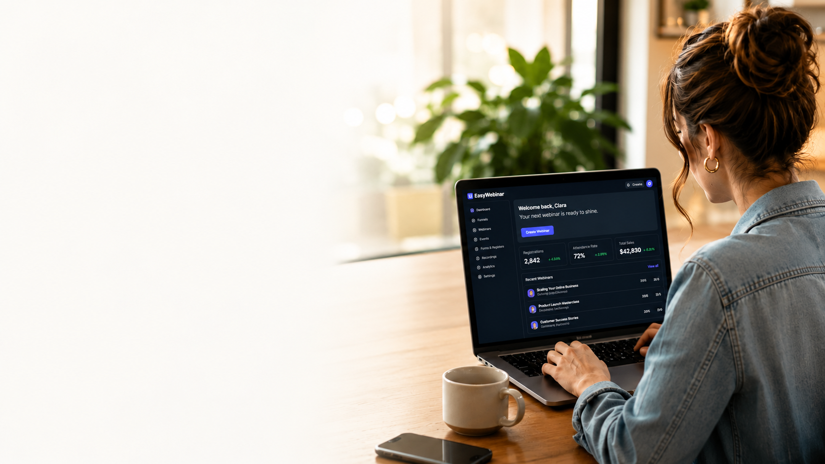 A brand owner reviewing the EasyWebinar dashboard on a laptop